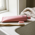 Euthymol pink fluoride-free thymol toothpaste on a toothbrush